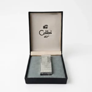 Briquet vintage Colibri GT en métal argenté présenté dans sa boîte d’origine