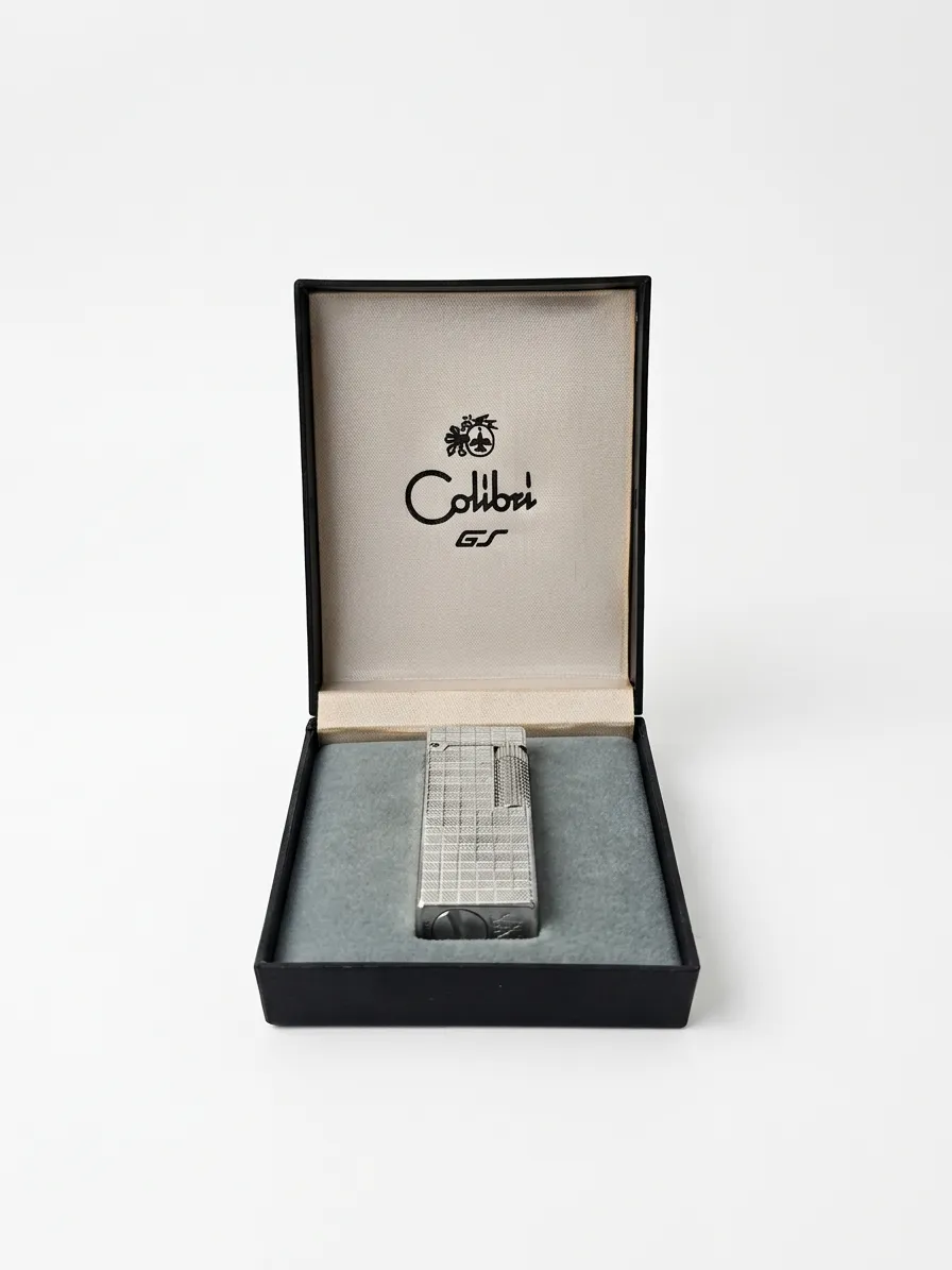 Briquet vintage Colibri GT en métal argenté présenté dans sa boîte d’origine