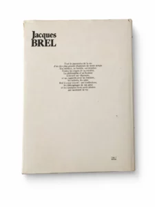 Couverture arrière de « Brel — Le livre du souvenir » par Martin Monestier, texte hommage en français et portrait de Jacques Brel.