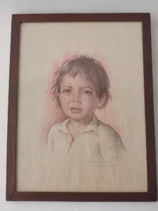 Portrait d’enfant signé G. Tencati, dessin au crayon et pastel sur papier, encadré bois